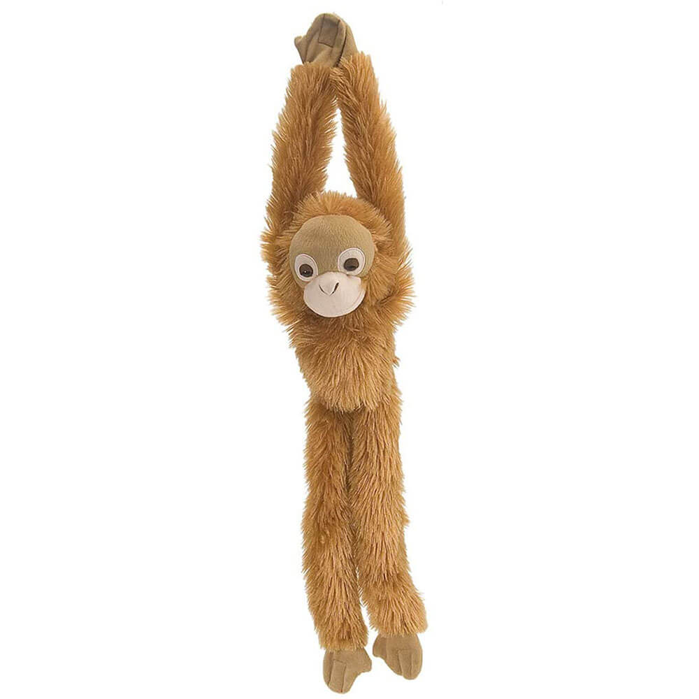 Macaco da República Selvagem pendurando brinquedo macio de pelúcia