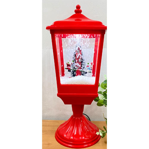 Lanterna da neve a LED con Babbo Natale e pupazzo di neve su altalena in movimento (rossa)